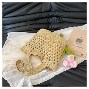 Détail de sac cabas tissé en paille, sac à épaule décontracté pour plage et vacances d'été.