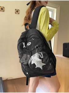 Mochila de estudiante de lona negra estilo INS japonés con bolsillo transparente.