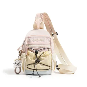 Color-blocked casual chest bag, lightweight nylon sling backpack with cute keychain.