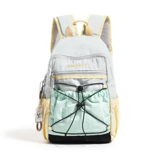 Detailed view of the color-blocked casual backpack featuring adjustable straps and front pocket.