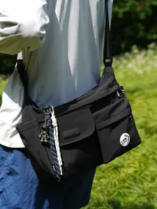 Black nylon crossbody messenger bag for students, casual daily shoulder bag with pockets.