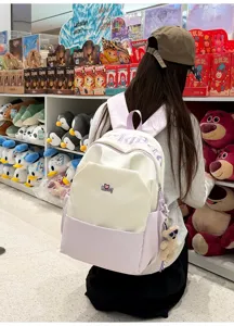 Simple contrast color canvas backpack with large capacity for student daily use and travel.