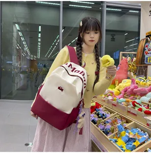 Large capacity color block student backpack with stylish letter print for daily school and casual use.