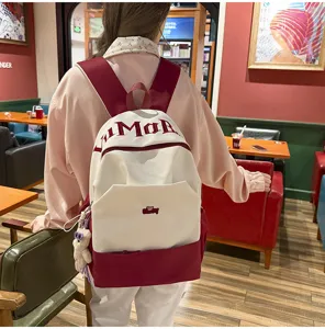 Minimalist color block large capacity school backpack for students, stylish aesthetic book bag.