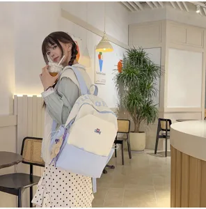 Stylish color block student backpack with large capacity for daily school and outdoor use.