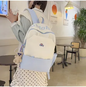 Large capacity color block school backpack for students, stylish casual daypack for daily use.