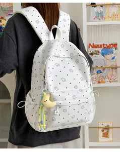 White nylon casual student backpack with cute star polka dots and plush moon pendant for use.