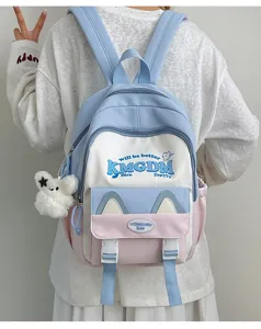 Cute colorblock canvas backpack for school students with cat ears and cute letter print details.