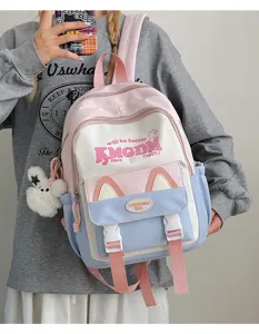 Cute color block school backpack detail featuring sweet cat ear design and stylish lettering.