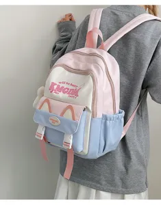 Pink blue colorblock backpack detail view with cute cat ear pocket and letter print design.
