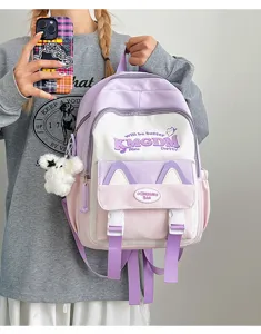 Cute contrast color canvas school backpack with letter print, large capacity for students.