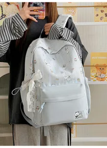 Cute Japanese style blue striped backpack with dog print and lace bow, large capacity for school.