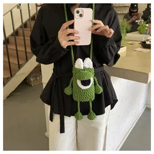 Cute green crochet phone bag with cartoon big eye design, perfect crossbody bag for daily wear.