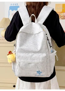 Casual nylon school backpack detail, large capacity with embroidery and side pockets for students.