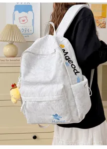Grey nylon large capacity school backpack with cute letter embroidery and floral detail.
