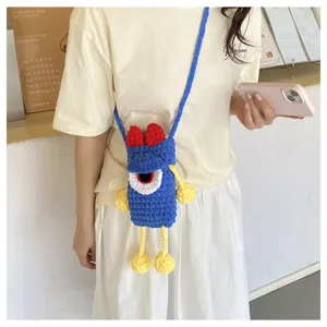 Handcrafted crochet blue monster phone bag with cute big eye, cross body cute style detail.