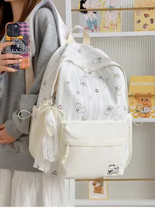 Detailed view of cute dog print school backpack with lace pearl pendant and roomy pockets.