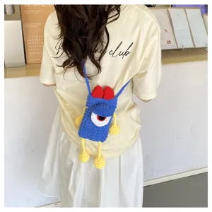 Cute handmade knitted one-eyed monster phone crossbody bag, vibrant contrast color design for women.