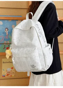 Casual nylon school backpack with embroidered letters, large capacity for student daily use.