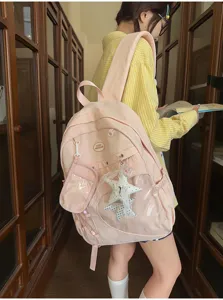 Zaino da studente rosa carino con tasca anteriore trasparente e ciondoli a stella per la scuola.