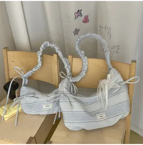 Blauwwit gestreepte plooischouertas schattige rits handvat strik detail casual tote tas