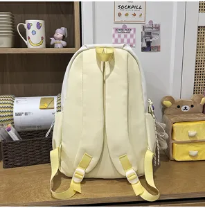 Color-block large capacity student school bag, stylish yellow and white backpack for daily use.