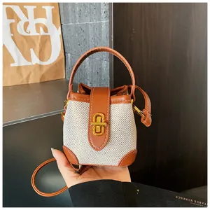 Chic mini δίχρωμη τσάντα bucket με χερούλι και λουρί για καθημερινό στυλ.