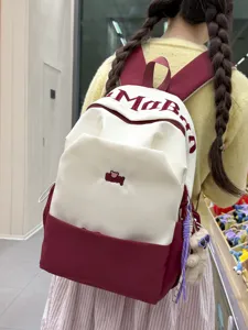 Stylish color-block student backpack with large capacity, perfect for daily school and casual use.