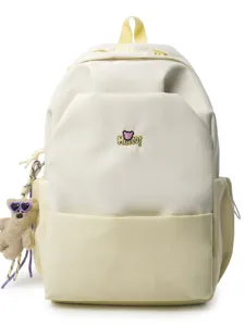 Spacious canvas school backpack with contrast color, cute bear pendant, stylish student bag.