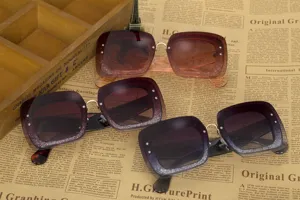 Large square frame sunglasses with glitter gradient lenses and stylish rhinestones for women.