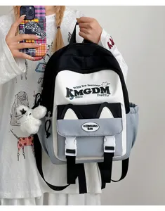 Detail shot of the cute color-block school backpack with cat ears and stylish letter print.