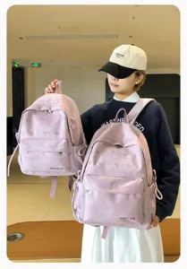 Japanischer minimalistischer Süßigkeitenfarben Rucksack mit niedlicher Schleife für Mädchen.