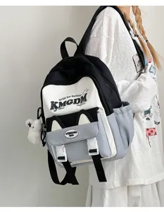 Detail view of the cute cat ear color block student backpack featuring trendy letter prints.