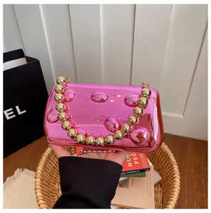 Bonbonfarbene Acryl Abendtasche mit Gold Perlenkette Griff, stilvolle modische Handtasche.
