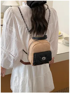 Detail view of woven PU contrast small women backpack with chain strap and quilted pocket.