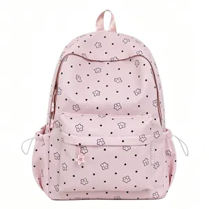 Pink nylon school backpack with cute star and dot print, large capacity casual daypack for girls.