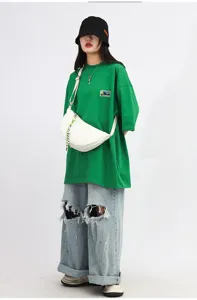 Close-up of the stylish nylon crescent crossbody dumpling bag showcasing its smooth zipper.