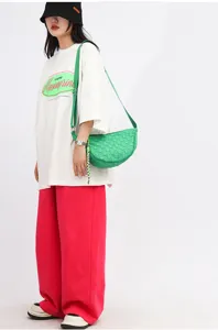 Green woven nylon crescent shoulder bag, casual streetwear fashion crossbody bag for daily use.