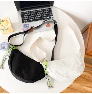 Stylish nylon crescent crossbody bag with minimalist grid texture, casual unisex daily shoulder bag.