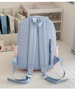 Light blue color-block student school backpack with adjustable straps and back zipper pocket.
