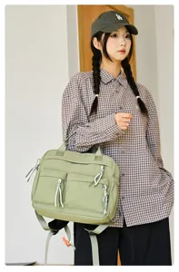 Sac à dos décontracté en nylon pour femme, style coréen, poches multiples, chic et pratique.