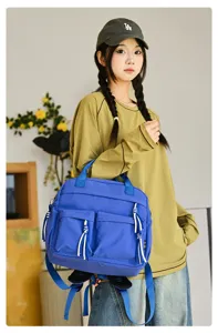 Sac à dos pour femme en nylon style coréen décontracté avec double poche et design bleu.