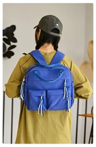 Sac à dos de petite taille en nylon décontracté style coréen pour femme, cartable chic bleu.