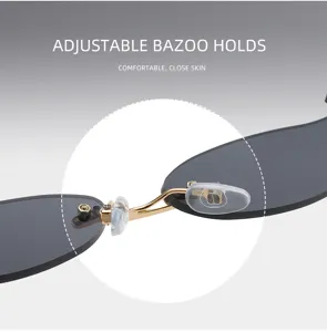 Rimless sunglasses metal nose bridge detail, transparent adjustable silicone nose pads close-up.