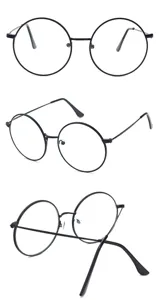 Dettaglio occhiali tondi in metallo nero vintage, montatura minimalista con lenti neutre.