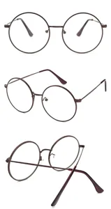 Occhiali rotondi retrò con dettagli intagliati sulle stanghette, stile classico ed elegante.