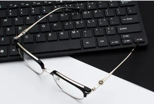 Details of vintage carved metal optical glasses frame, classic retro design for daily wear.