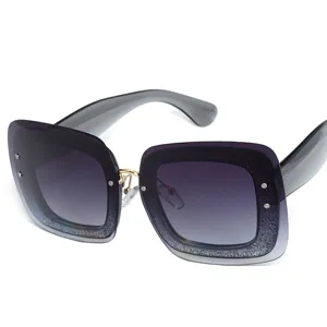 Fashionable large frame sunglasses with gradient glitter design, stylish sun protection eyewear.