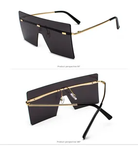 Vista detallada de las gafas de sol de pantalla plana oversize con montura de metal dorado.