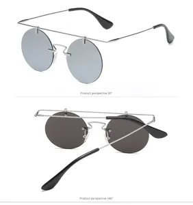 Vue détaillée de lunettes de soleil rondes vintage en métal avec double pont et verres gris.